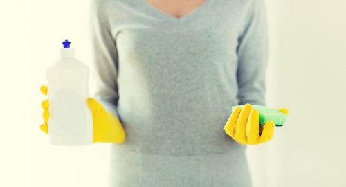 Careful cleaning of fabric armchairs in a Barnes property