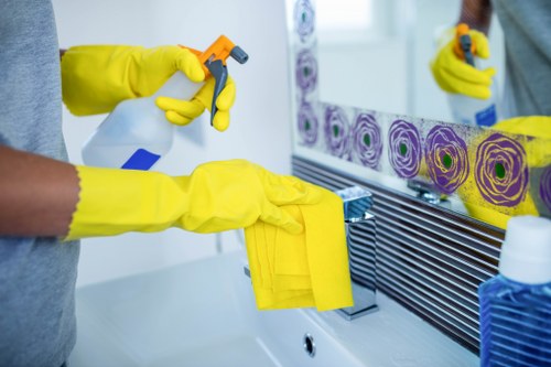Professional cleaner maintaining shared stairs and entrance areas